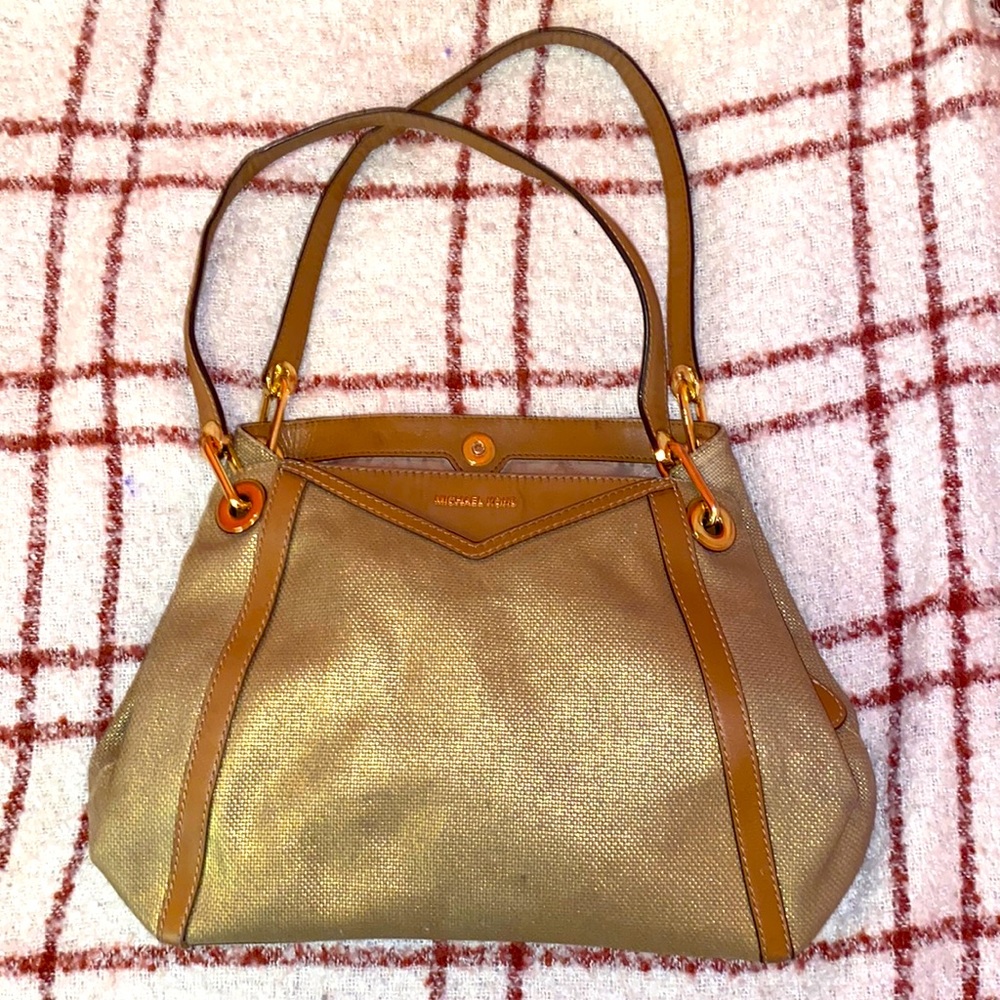 Gold metallic cotton canvas. Easy to carry and maintain. Fairly new shoulder bag